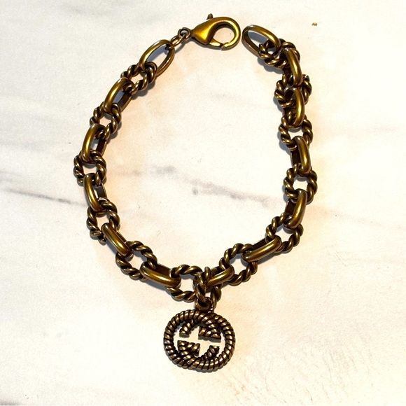 Fancy Link Chain
Antique Gold Finish
Bracelet With Double G
Motif 7” - Picture 3 of 11